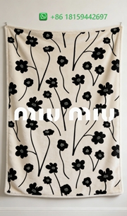 Miumiu Throw Blankets